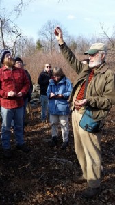 David Brown, naturalist and tracker, showing the group how to identify what type of squirrel ate which hickory nut.